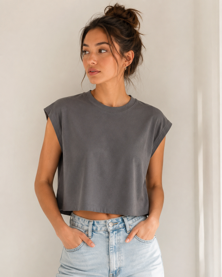 Woman styling Aloomie Castle Rock sleeveless boxy-fit T-shirt with light-wash jeans