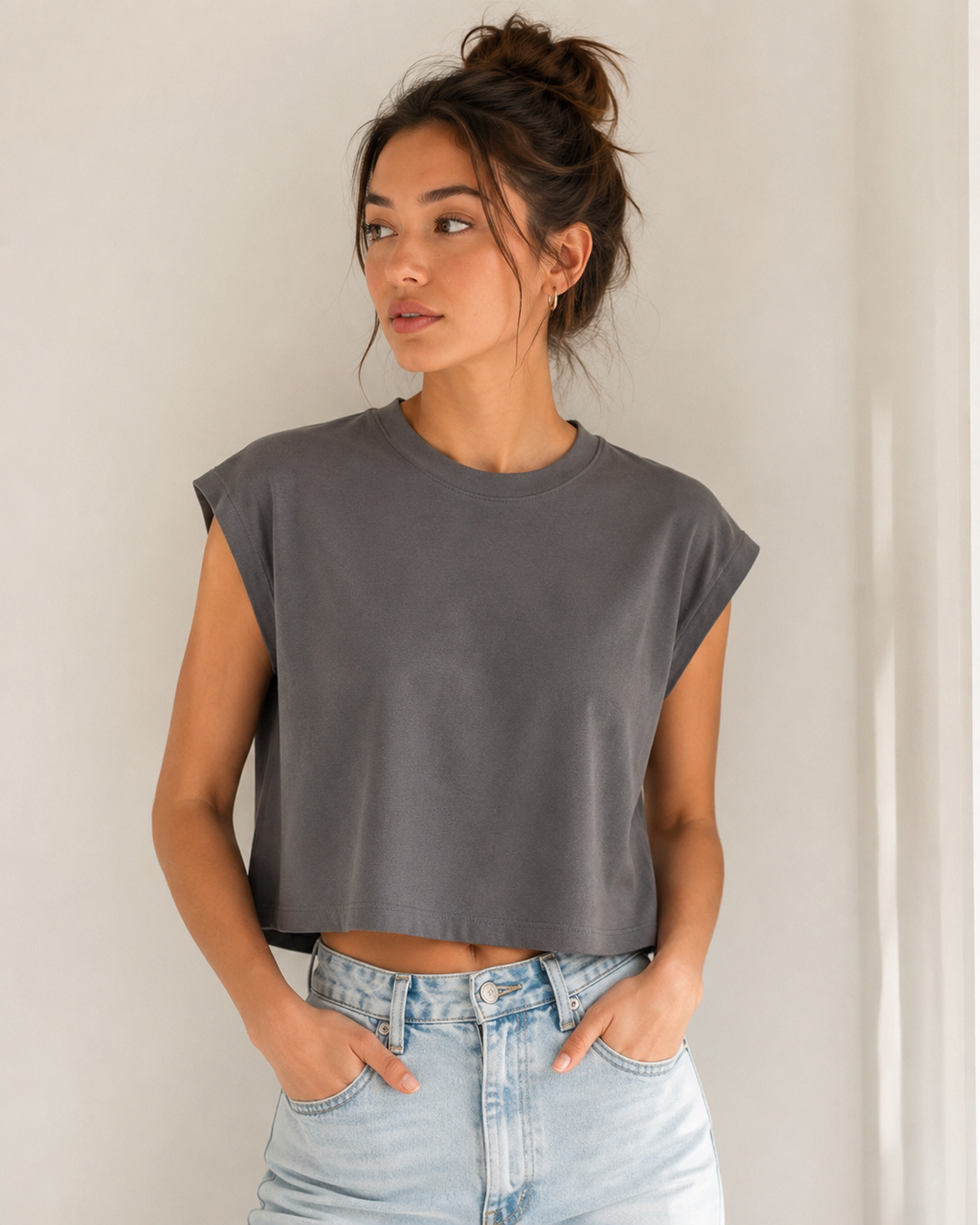 Woman styling Aloomie Castle Rock sleeveless boxy-fit T-shirt with light-wash jeans